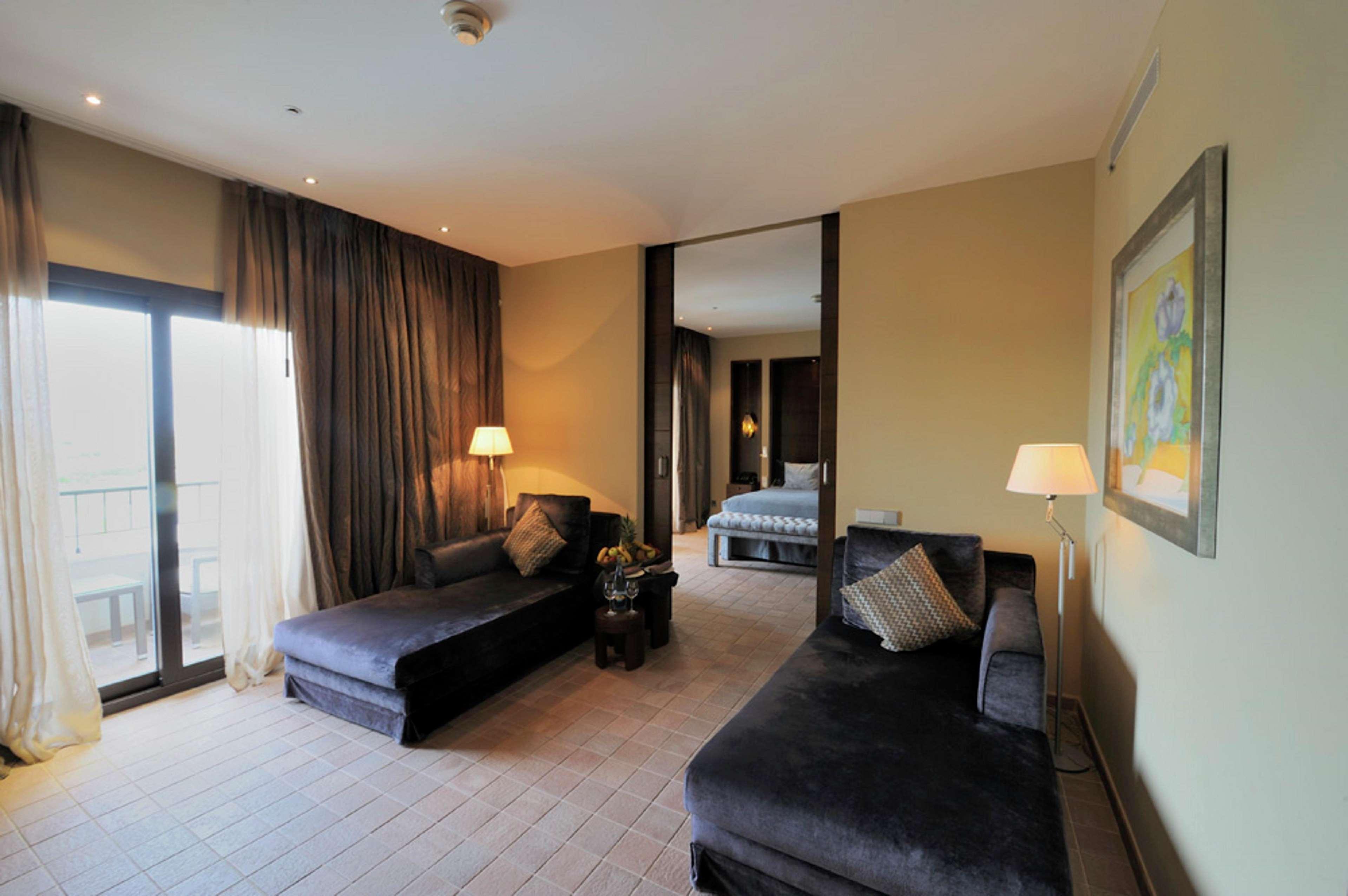 Doubletree By Hilton La Torre Golf Resort Roldán Εξωτερικό φωτογραφία A suite at the hotel